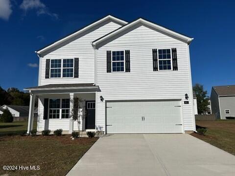 front of property with a garage