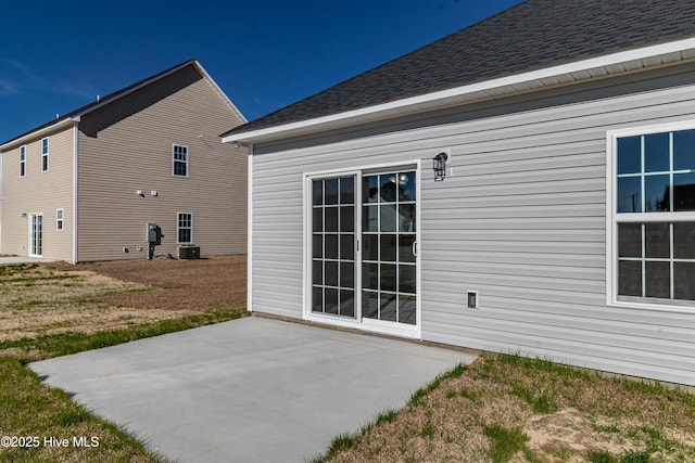 back of house with central AC and a patio area