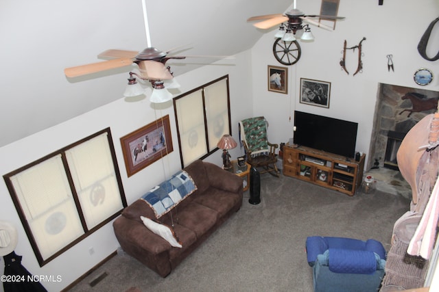 carpeted living room featuring ceiling fan, a fireplace, lofted ceiling, and visible vents