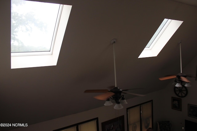 room details with a ceiling fan and a skylight