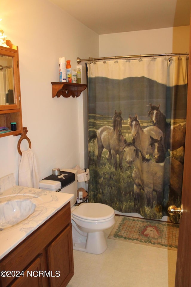 full bathroom with toilet, tile patterned floors, a shower with shower curtain, and vanity