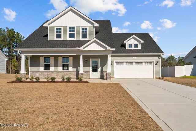 craftsman-style home with a porch and a garage