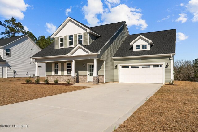 view of front of home featuring a porch and a garage