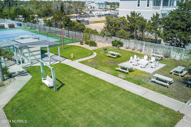 view of home's community featuring fence and a pergola