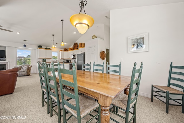 dining room featuring high vaulted ceiling, recessed lighting, ceiling fan, and a tiled fireplace