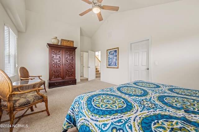 carpeted bedroom featuring high vaulted ceiling, visible vents, and a ceiling fan