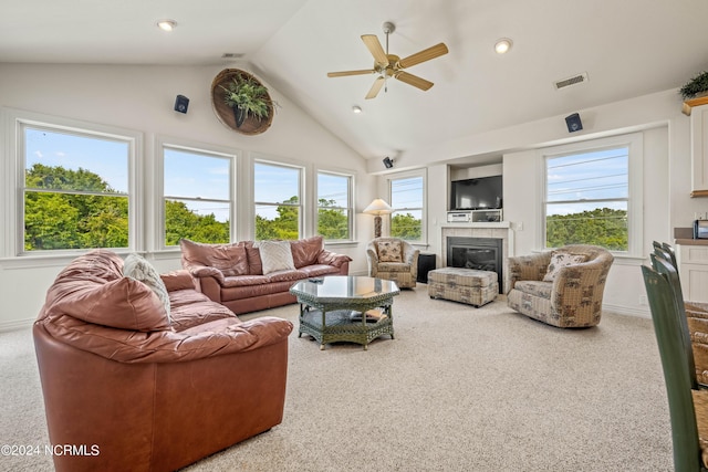 carpeted living room featuring recessed lighting, visible vents, vaulted ceiling, and a tiled fireplace