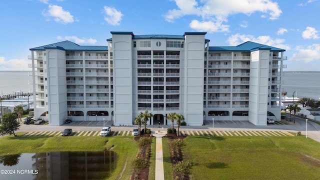 view of building exterior with a water view