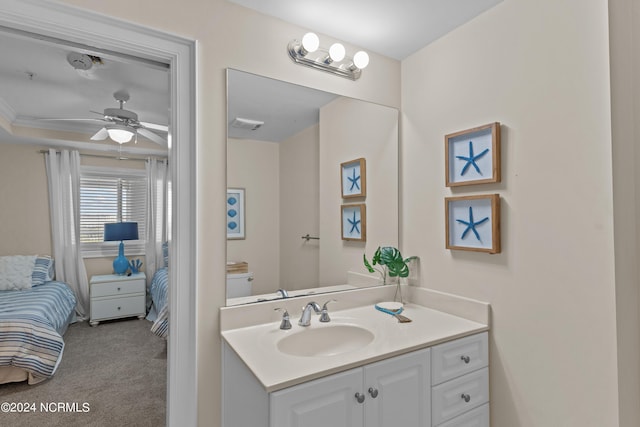 bathroom with visible vents, connected bathroom, toilet, ceiling fan, and vanity