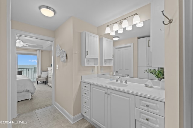 bathroom with tile patterned flooring, ceiling fan, and vanity