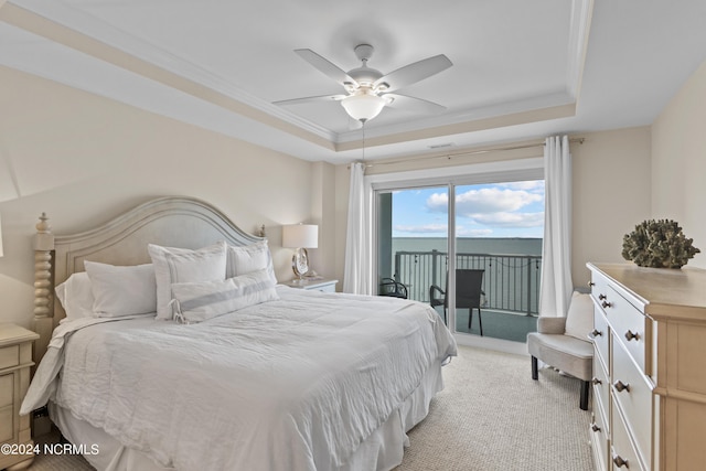 bedroom featuring access to outside, ornamental molding, a raised ceiling, and light colored carpet