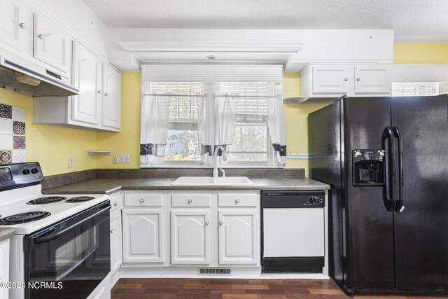 kitchen featuring sink, dark hardwood / wood-style flooring, white appliances, and white cabinets