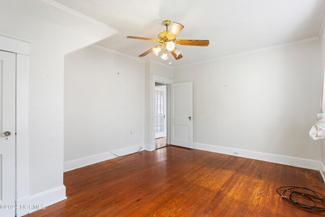 spare room with ceiling fan, ornamental molding, and hardwood / wood-style flooring