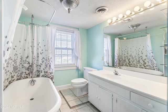 full bathroom featuring toilet, a textured ceiling, tile patterned flooring, vanity, and shower / tub combo