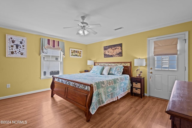 bedroom with crown molding, light hardwood / wood-style flooring, and ceiling fan