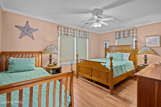 bedroom with ceiling fan, a textured ceiling, crown molding, and light hardwood / wood-style flooring