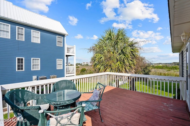 deck featuring outdoor dining area