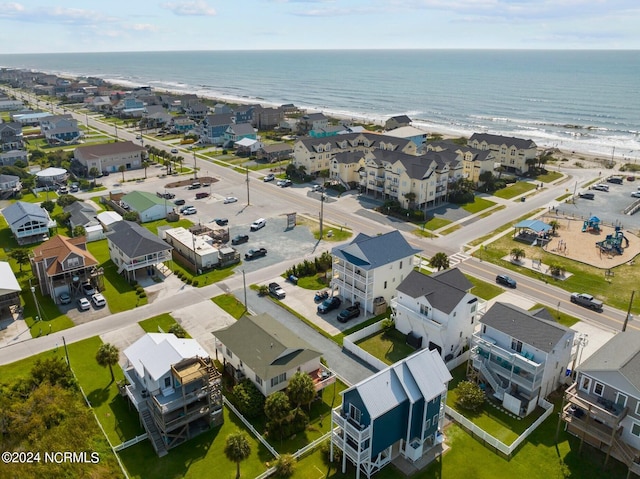 bird's eye view featuring a beach view and a water view