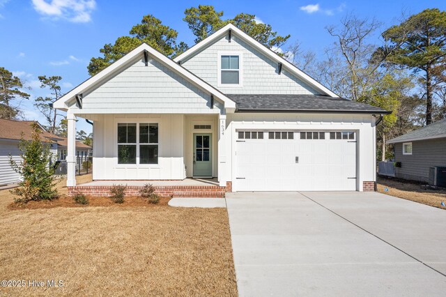 back of house featuring covered porch