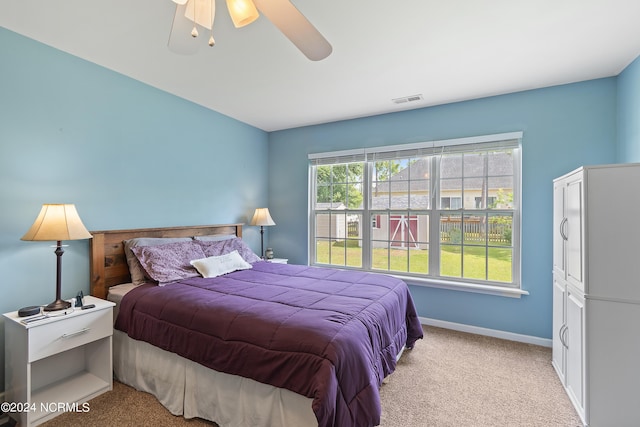 carpeted bedroom with ceiling fan