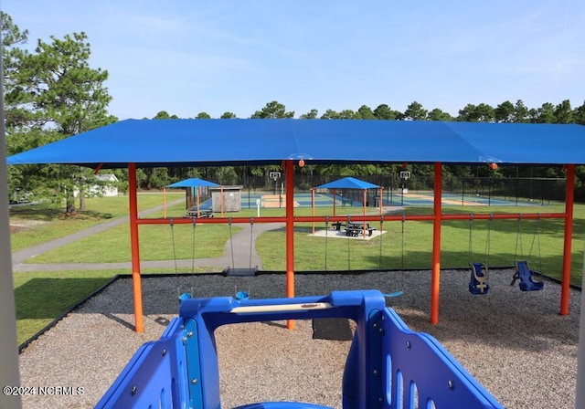 view of jungle gym featuring a lawn