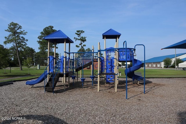 view of playground with a lawn