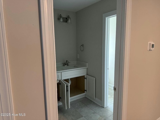 bathroom with tile patterned flooring and sink