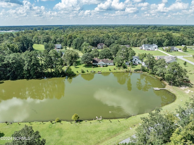 aerial view featuring a water view and a wooded view