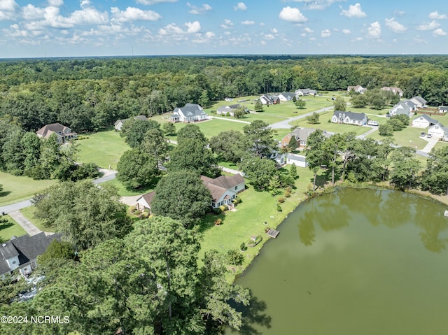 aerial view featuring a water view and a wooded view