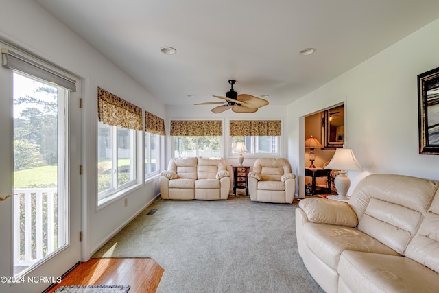 living area with a ceiling fan, recessed lighting, light wood-type flooring, and visible vents