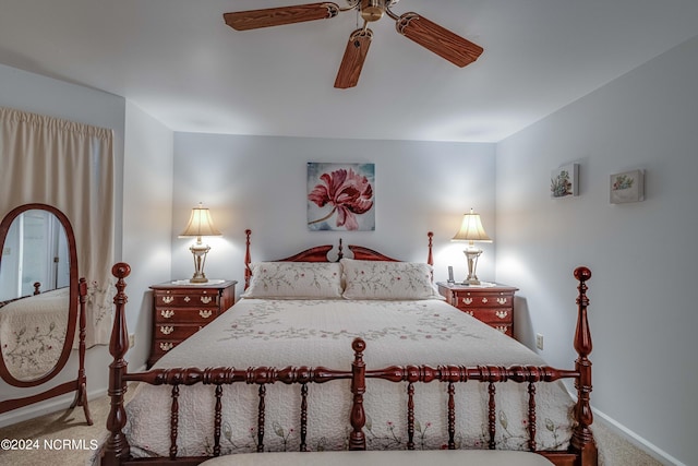 carpeted bedroom with baseboards and a ceiling fan