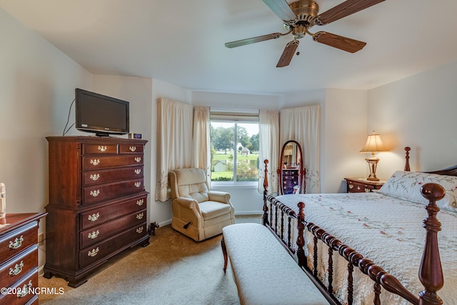 carpeted bedroom with baseboards and a ceiling fan