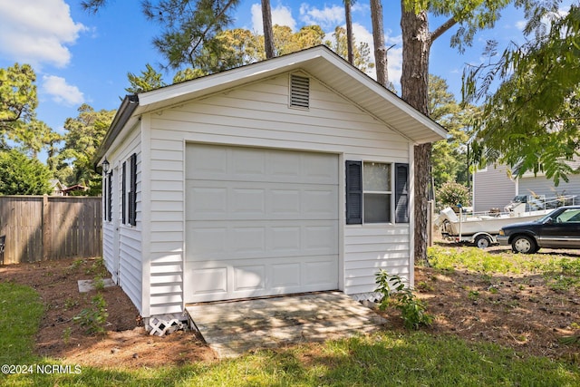 detached garage with fence