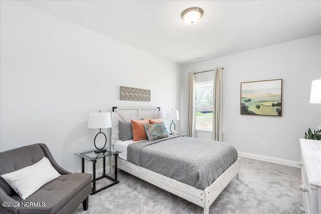 bedroom with carpet and baseboards