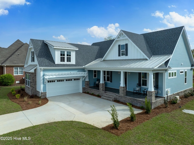 9307 Old Salem Way, Calabash, NC 28467 - view of front of home featuring concrete driveway, a porch, a standing seam roof, roof with shingles, and a garage