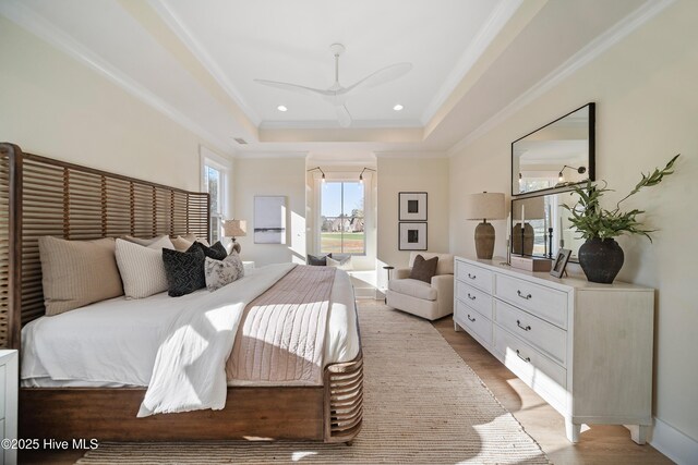 9307 Old Salem Way, Calabash, NC 28467 - bedroom with access to outside, a raised ceiling, light wood-style floors, ornamental molding, and ceiling fan