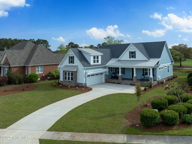 9307 Old Salem Way, Calabash, NC 28467 - view of front facade with a porch, driveway, a front yard, and metal roof
