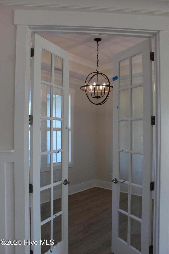 kitchen with pendant lighting, sink, white cabinetry, gas stovetop, and a center island with sink