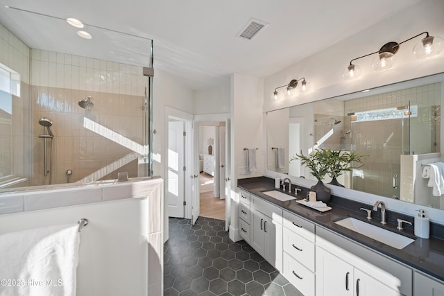 9307 Old Salem Way, Calabash, NC 28467 - full bath with double vanity, a stall shower, and tile patterned flooring