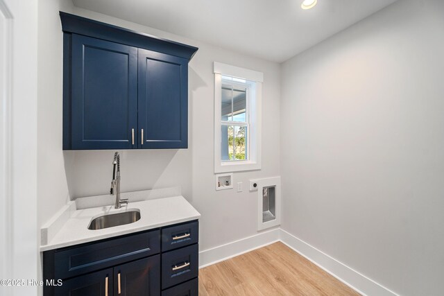9307 Old Salem Way, Calabash, NC 28467 - washroom with cabinet space, hookup for a washing machine, hookup for an electric dryer, light wood-style flooring, and baseboards