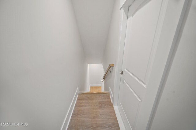 9307 Old Salem Way, Calabash, NC 28467 - staircase featuring wood finished floors and baseboards