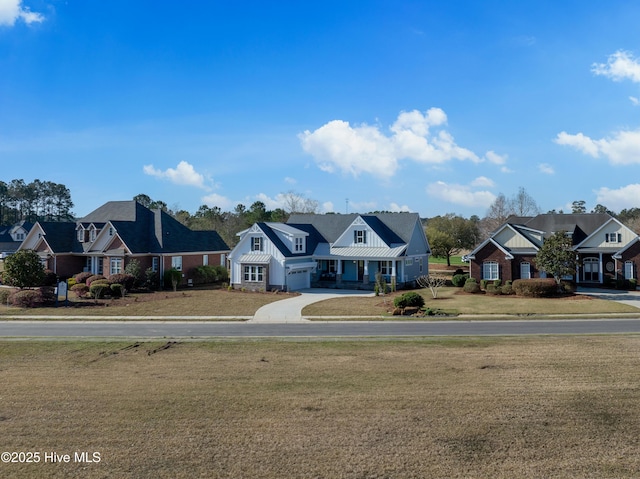 9307 Old Salem Way, Calabash, NC 28467 - view of front of property with a front yard, a residential view, and a garage