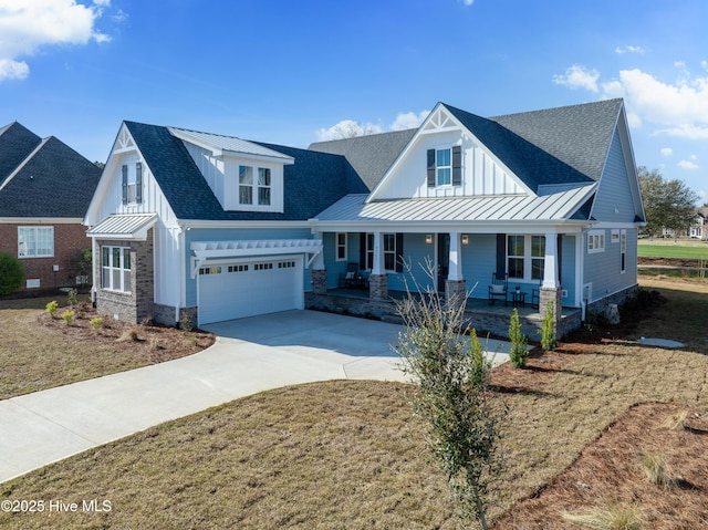 9307 Old Salem Way, Calabash, NC 28467 - modern inspired farmhouse with a standing seam roof, covered porch, concrete driveway, metal roof, and board and batten siding