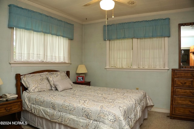 bedroom with ornamental molding, carpet flooring, and ceiling fan