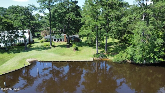 exterior space with a yard and a water view