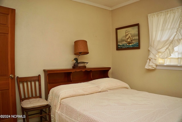 bedroom featuring crown molding