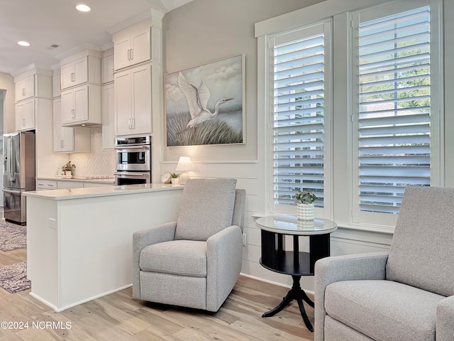 sitting room with light hardwood / wood-style floors