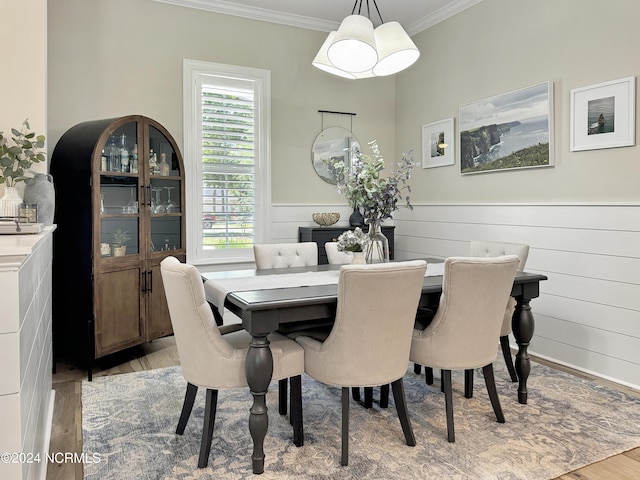 283 Golfview Ct SW, Supply, NC 28462 - dining space featuring wainscoting, crown molding, and light wood finished floors