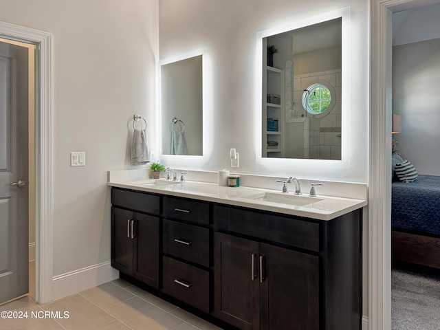 bathroom with tile patterned flooring and vanity