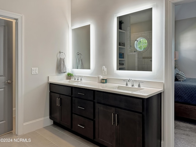 283 Golfview Ct SW, Supply, NC 28462 - ensuite bathroom with tile patterned floors, double vanity, a sink, and ensuite bathroom